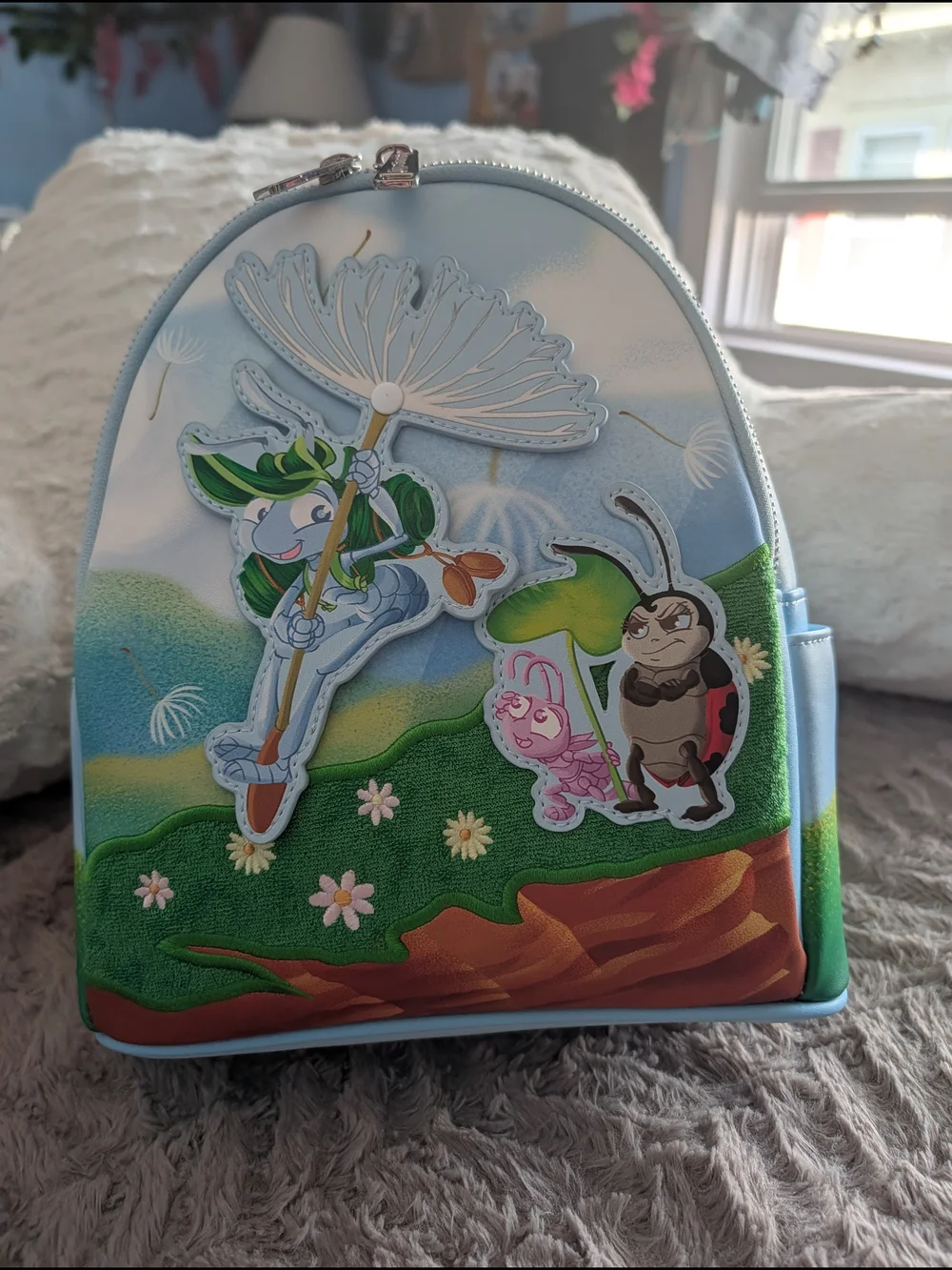 Loungefly Light Blue Kids Mini Backpack with Playful Nature Characters
